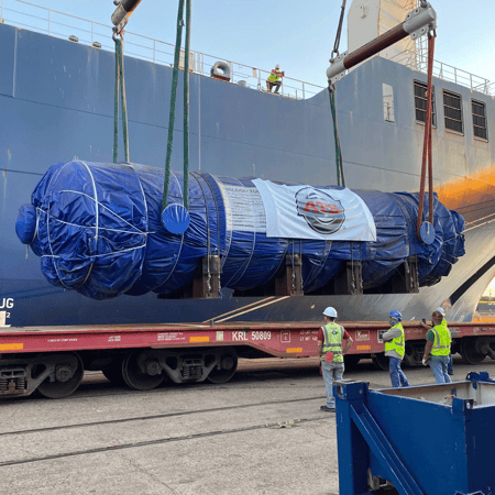 Flue gas vessel being loaded onto a rail car